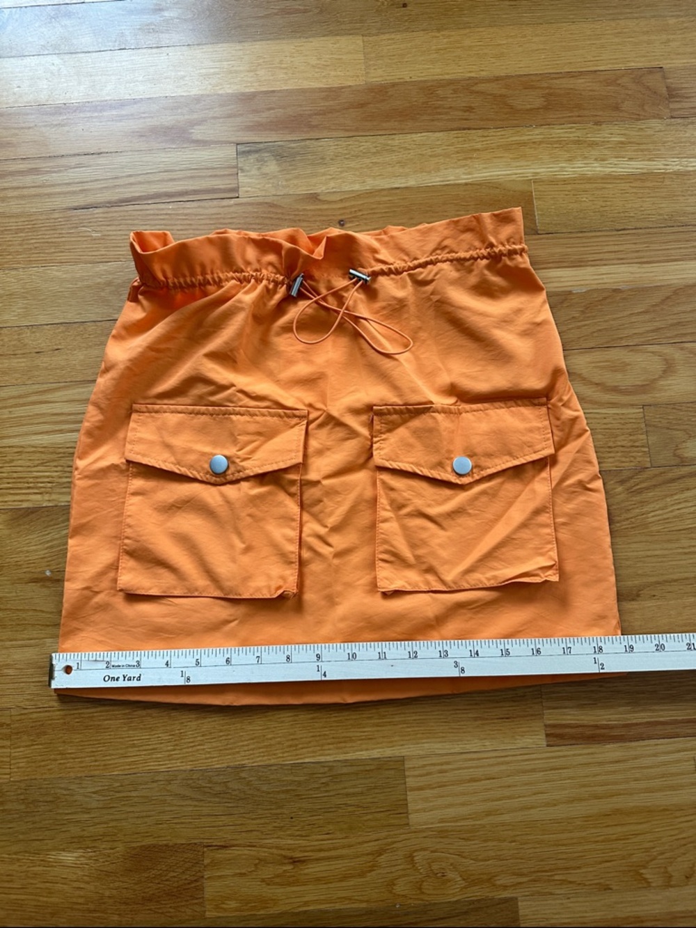 NWT/ Size-Small- Bright Orange mini skirt/ wind breaker like material